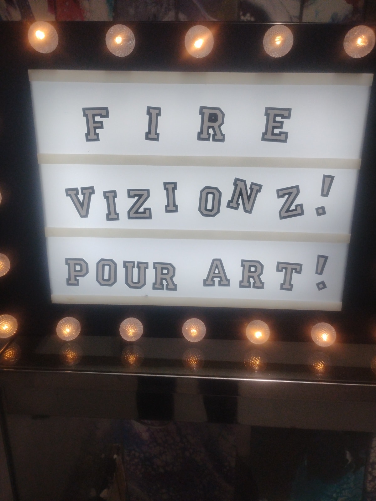 Fire Vizionz marquee sign at Super Flea